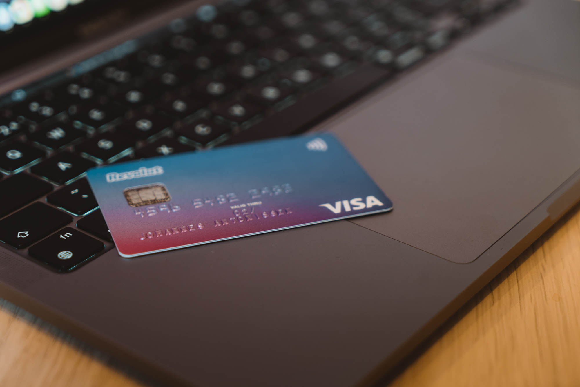 Bank card and laptop - buying the right travel insurance article