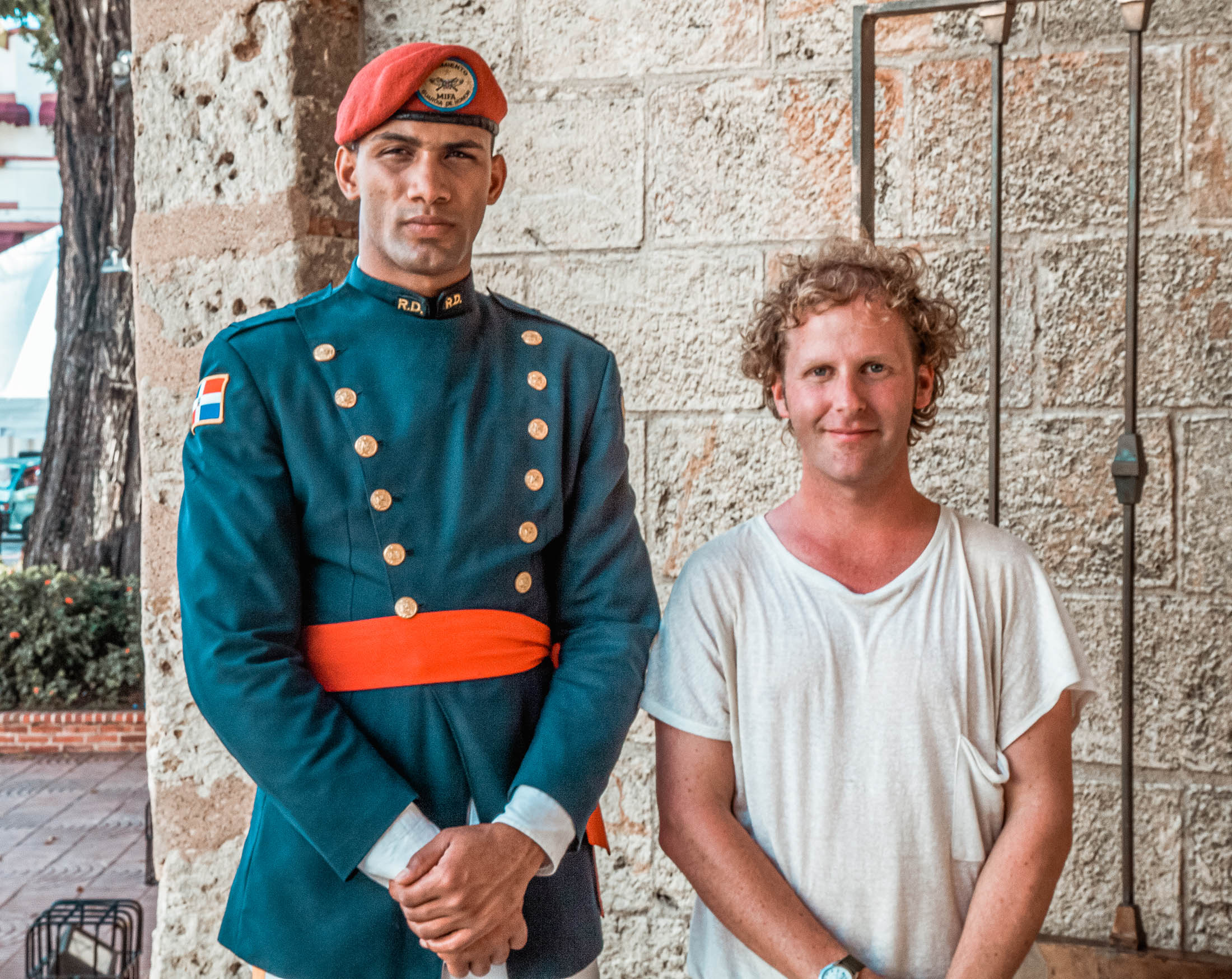 Ben with beautiful A Dominican man in uniform outside Parque Independencia Santo Domingo visiting the Dominican Republic