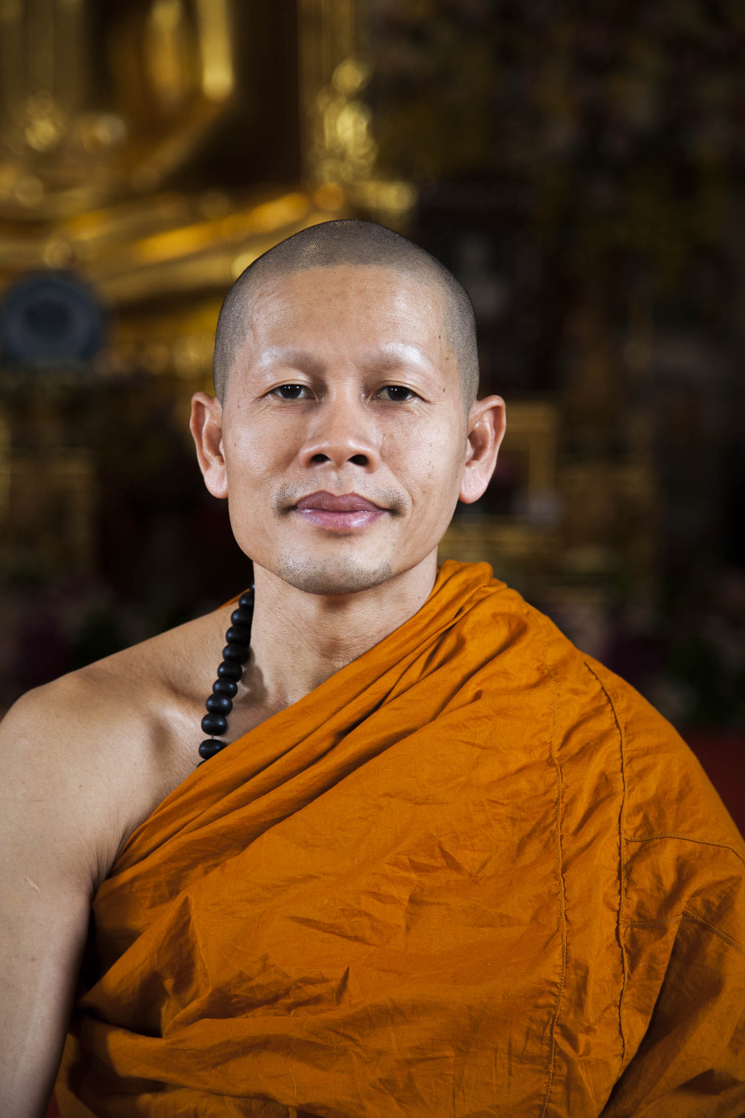 Monk inside Wat Trai Mit, Bangkok, Thailand