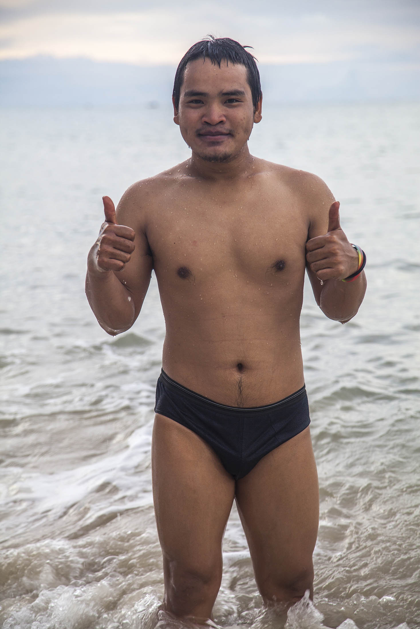 Thai man in underwear on Bang Po beach Koh Samui Thailand (not cropped)