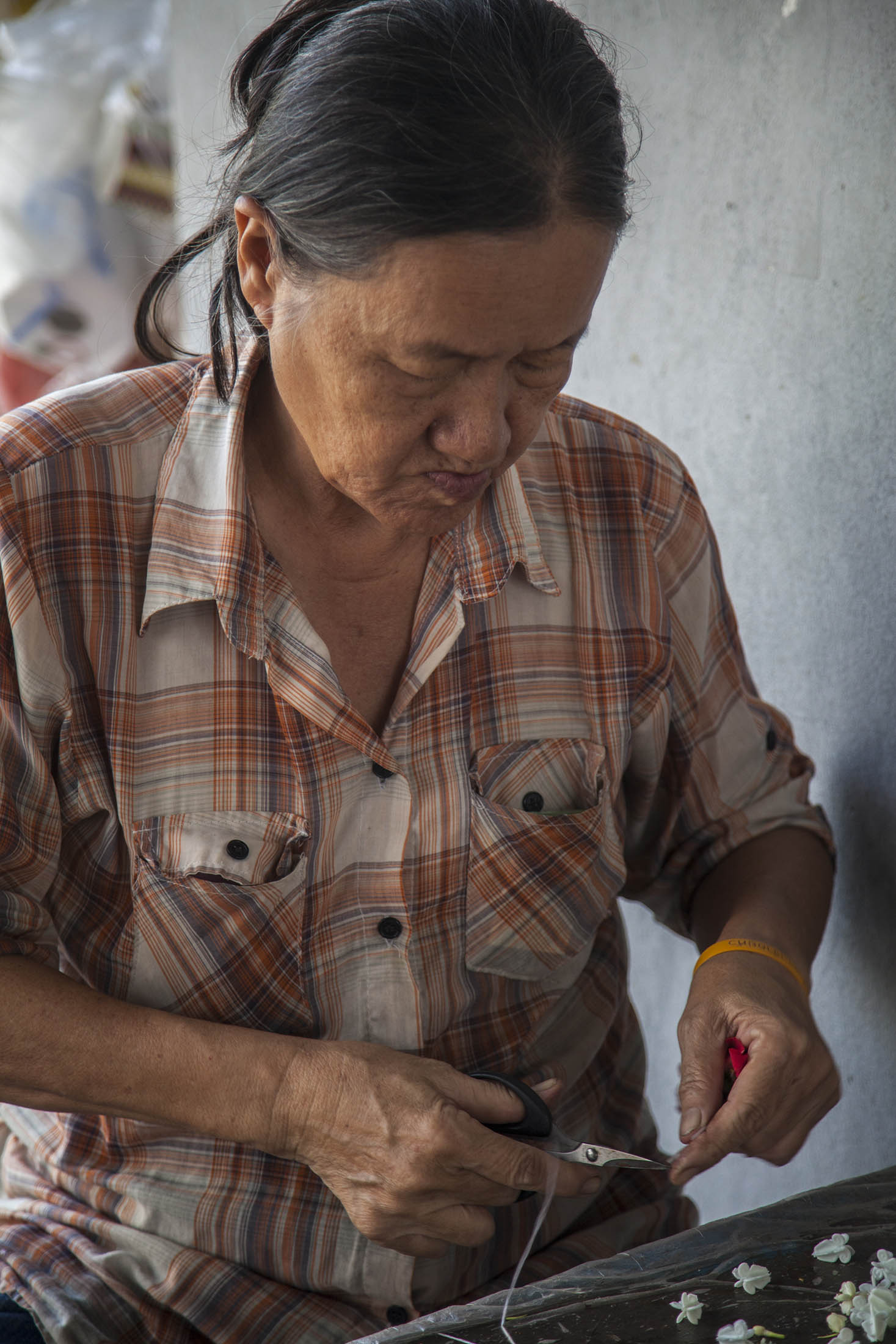 Woman selling craft on street in Bangkok, Thailand